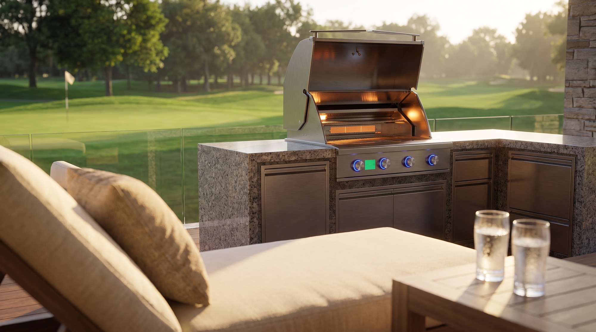 View from a lounge chair toward a JetKev grill with its lid open, the golf course beyond